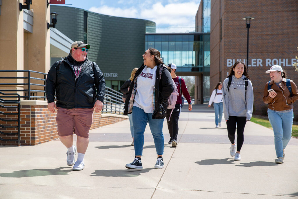 Students walking between buildings on campus