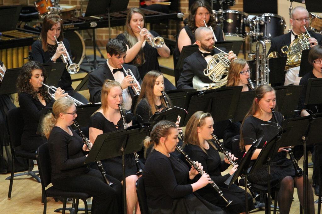 Students performing in an orchestra concert