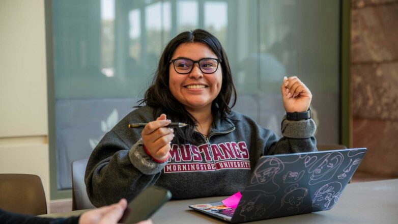 Female Student With Open Laptop