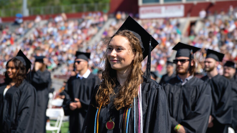 Female graduate sitting