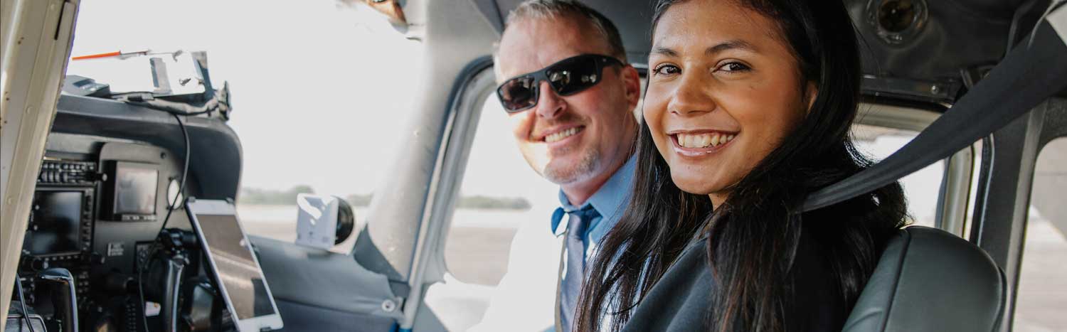 Aviation Student With Instructor In Plane