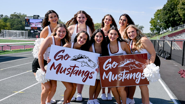 Cheer Leaders Holding Signs