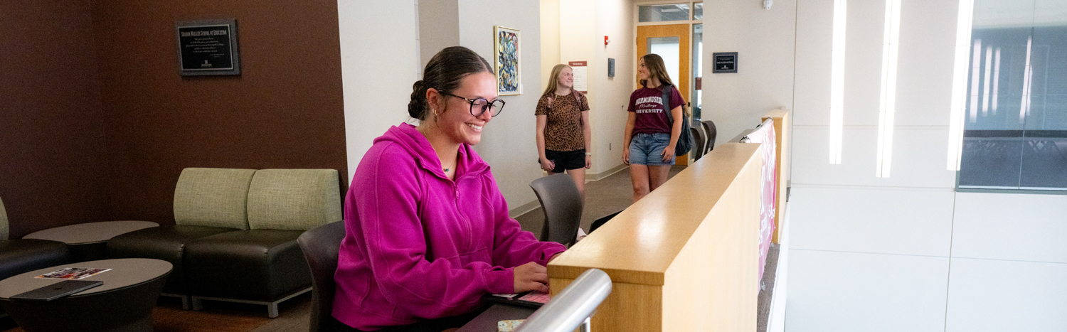 A student studying on the balcony of Eppley