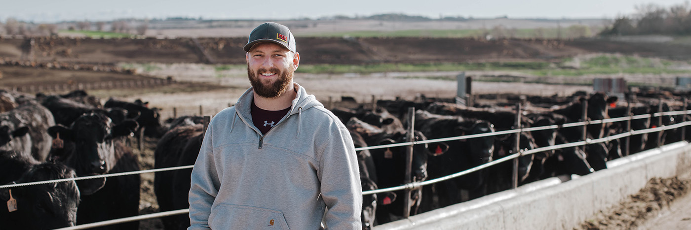 Morningside student standing in front of black angus