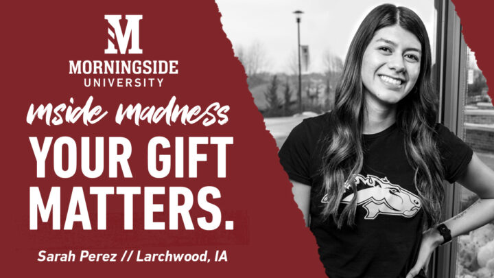 Black and white photo of Morningside student standing in front of window