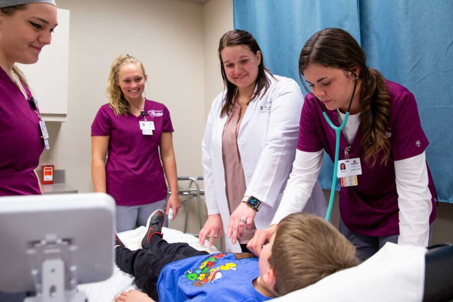 Nursing Students Examining Patient