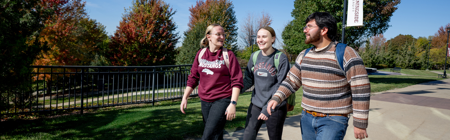 A group of students walking across campus