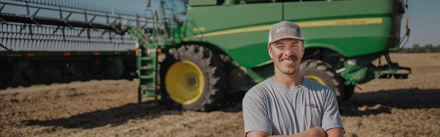 Student In Front Of John Deere Combine