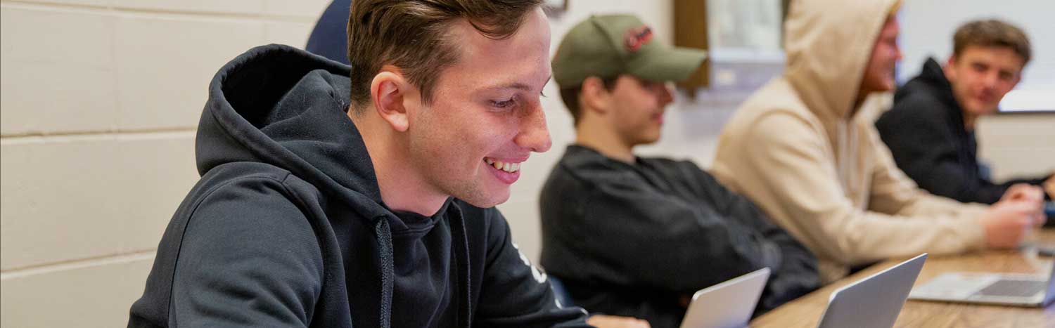 Student Studying On Laptop In Class