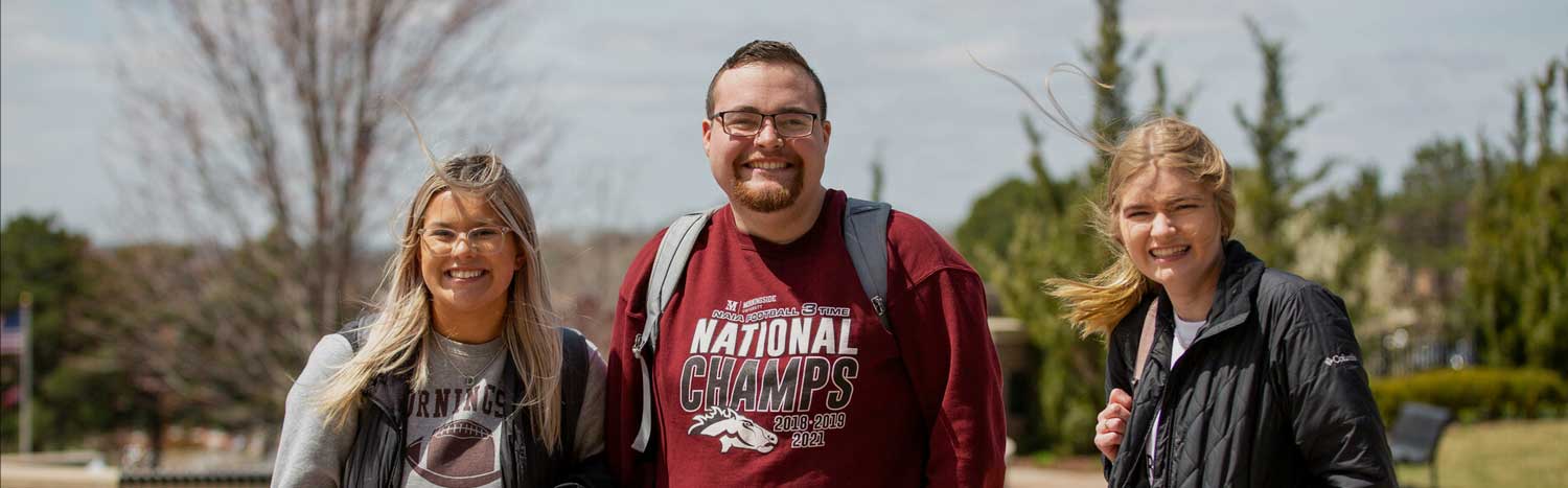 Students On Campus Mall Smiling