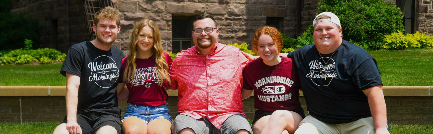 Students Sitting On Bench