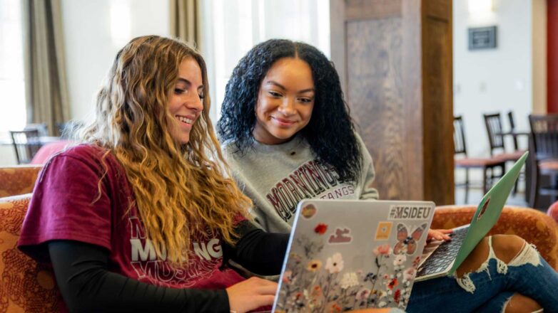 Students Sitting On Couch In Dimmitt Hall