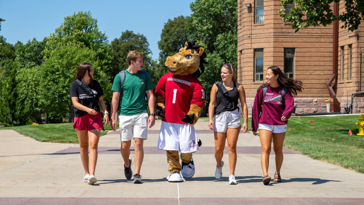 Students Walking On Campus Mall With Monte The Mustang