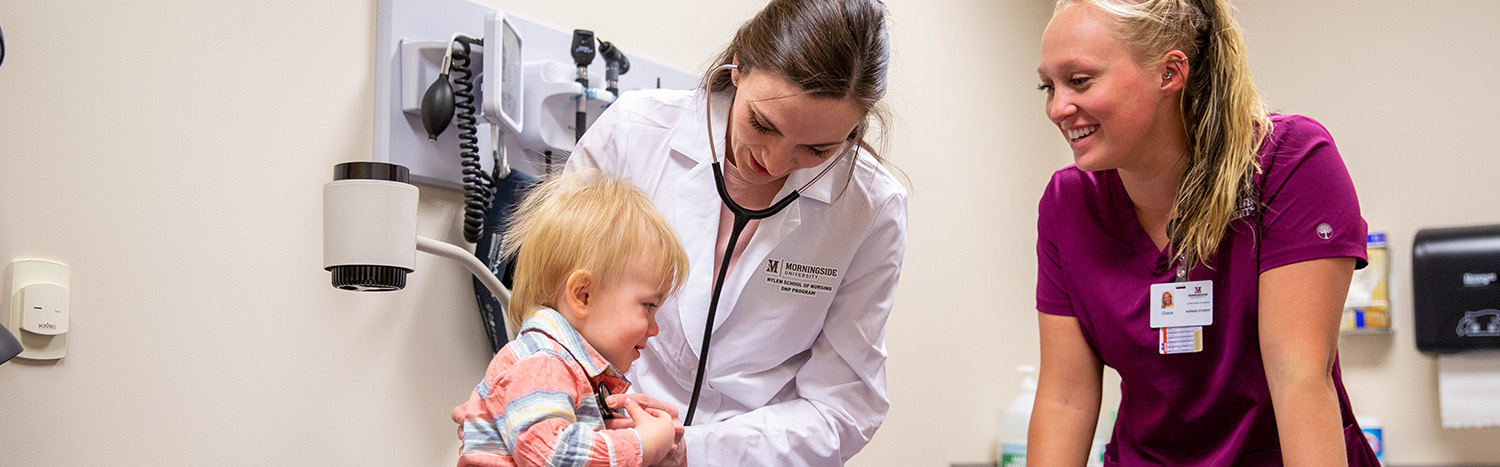 Two nursing students with toddler