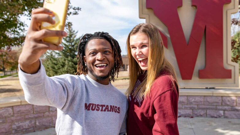 Two Students Taking Selfie In On Plaza 