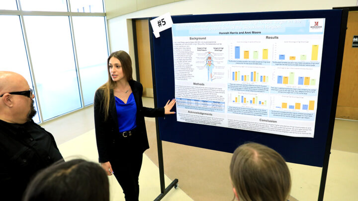 Morningside student presenting poster at Palmer
