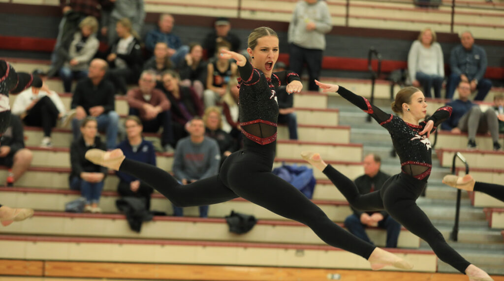 Morningside dance performs during halftime of a basketball game.