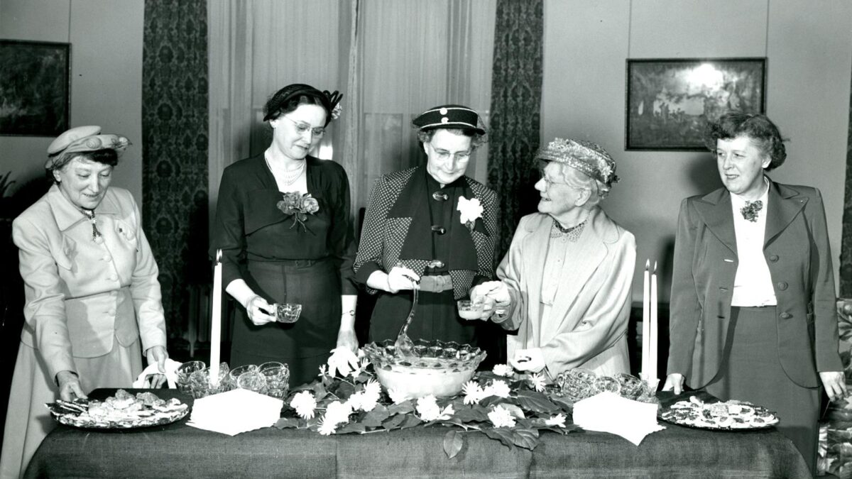 Lillian Dimmitt with four ladies surrounded by food