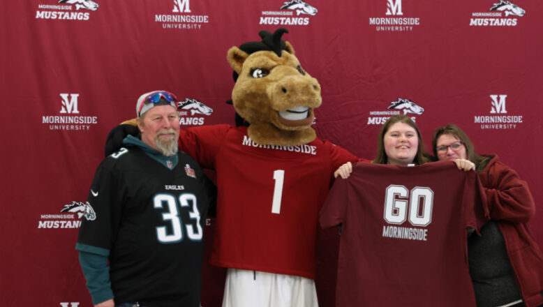 family posing with Monte the Mustang at admitted students day