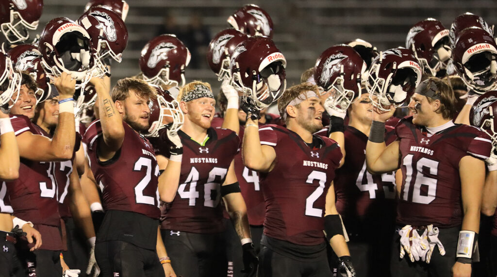 The football team celebrates a win.