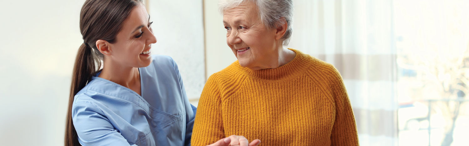 nurse caring for elderly patient