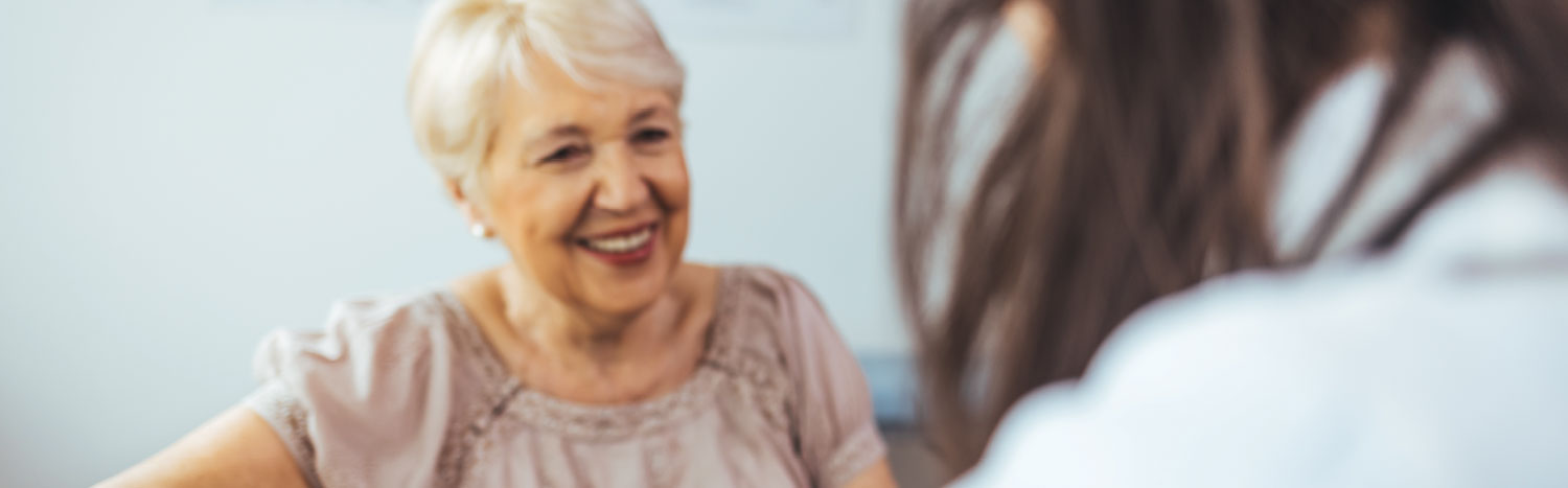 doctor meeting with elderly patient