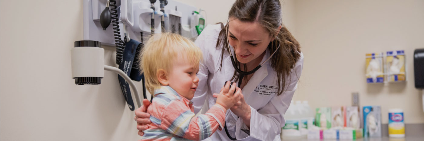 graduate nursing student with patient