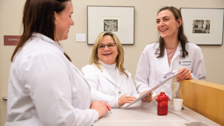 graduate nursing students with professor