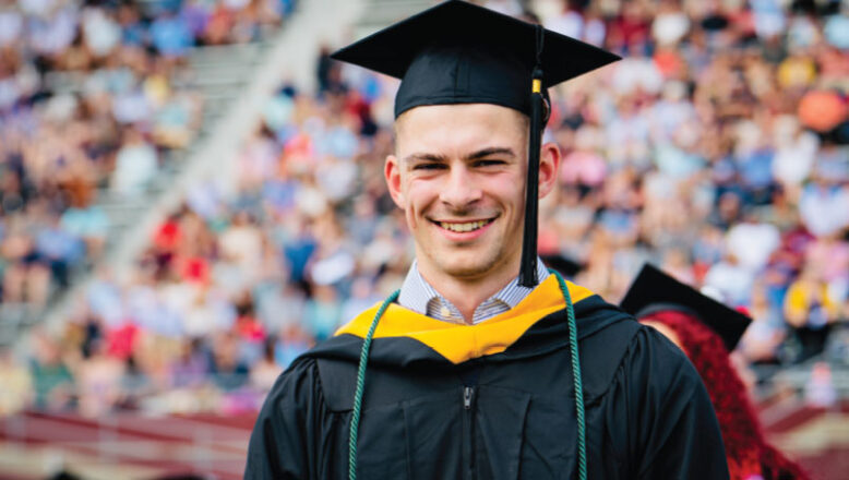graduate smiling at commencement