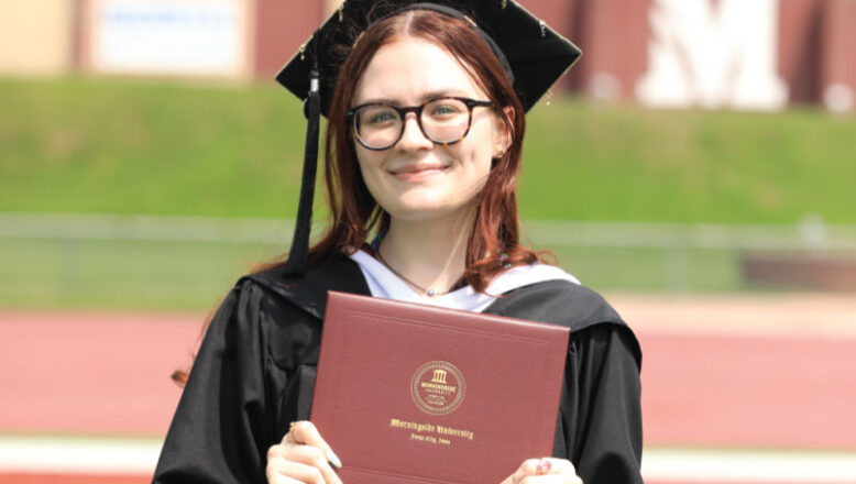 Morningside graduate with diploma