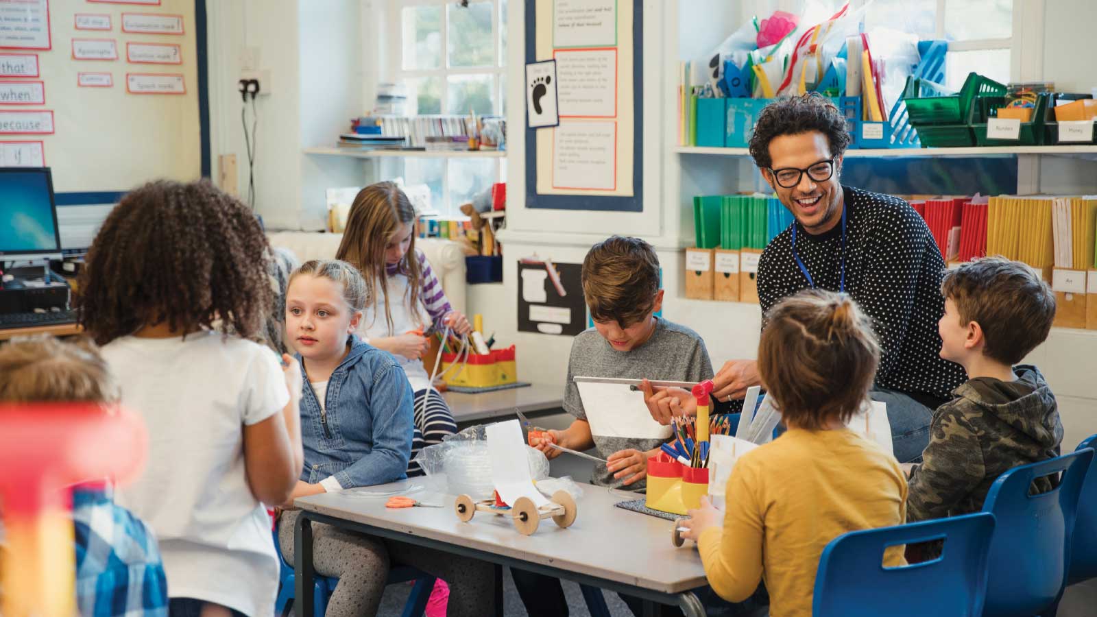 man teaching elementary age students