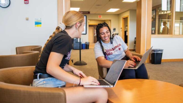 two students meeting in learning center