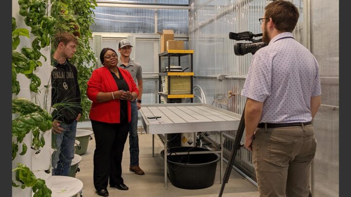 Morningside professor talks with tv reporter