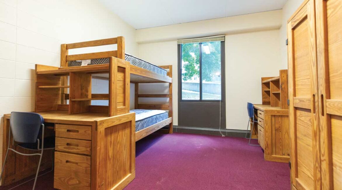 A room in the plex. Bunk beds, two desks, and a closet.