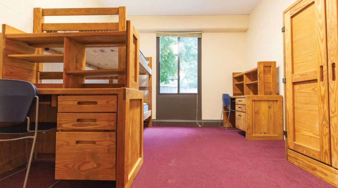 A room in the plex. Bunk beds, two desks, and a closet.