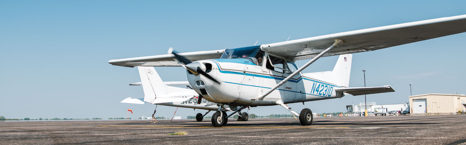 student flying with instructor