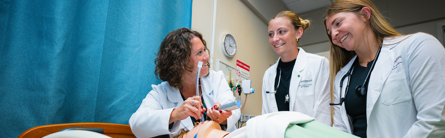Professor giving a demonstration to nursing students