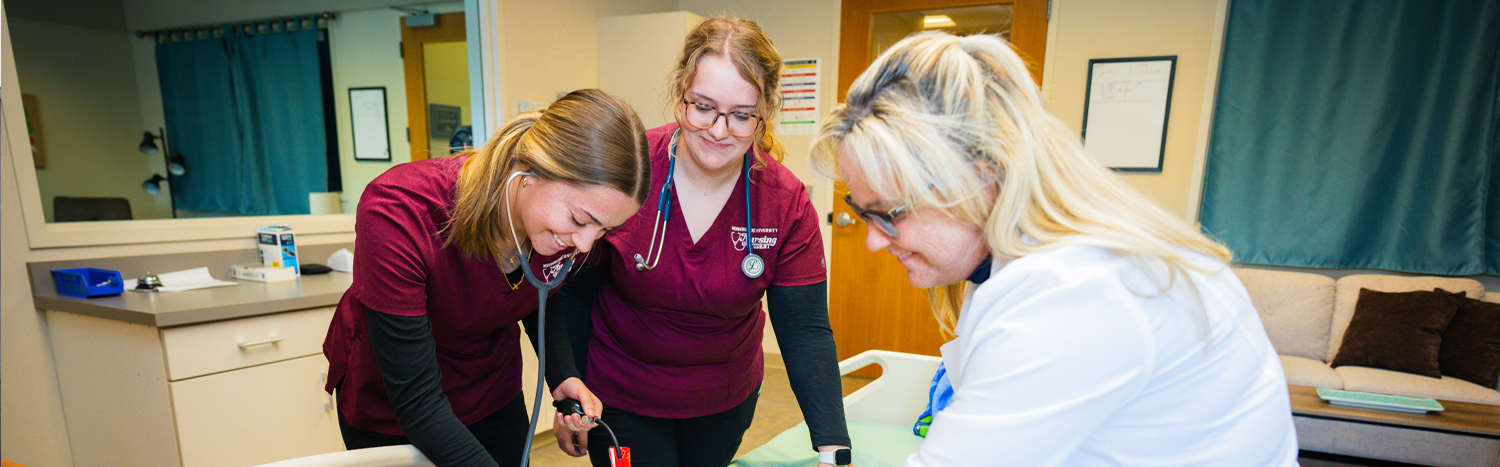 Nursing students with instructor