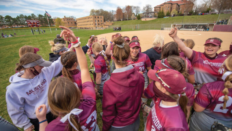 softball ladies huddled up on field