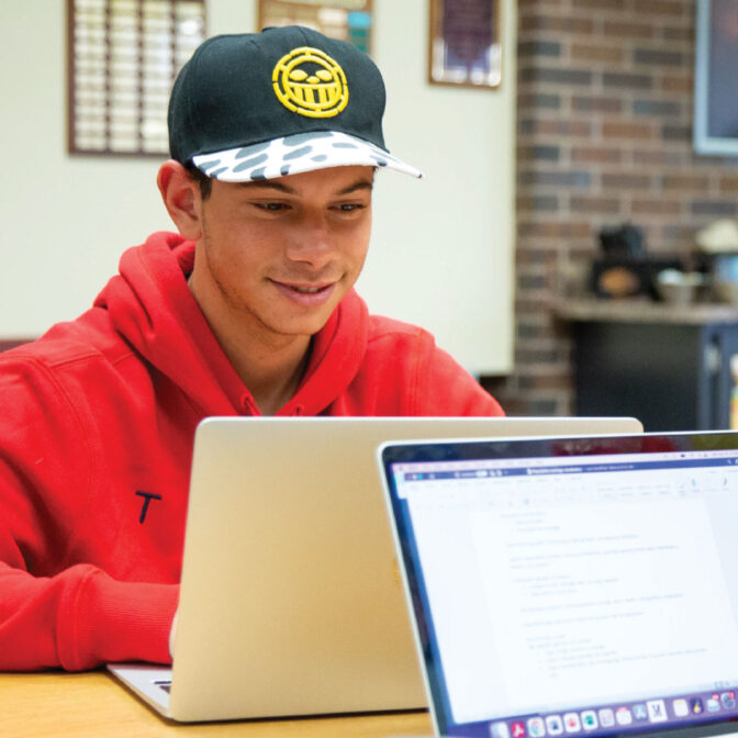 student studying in library