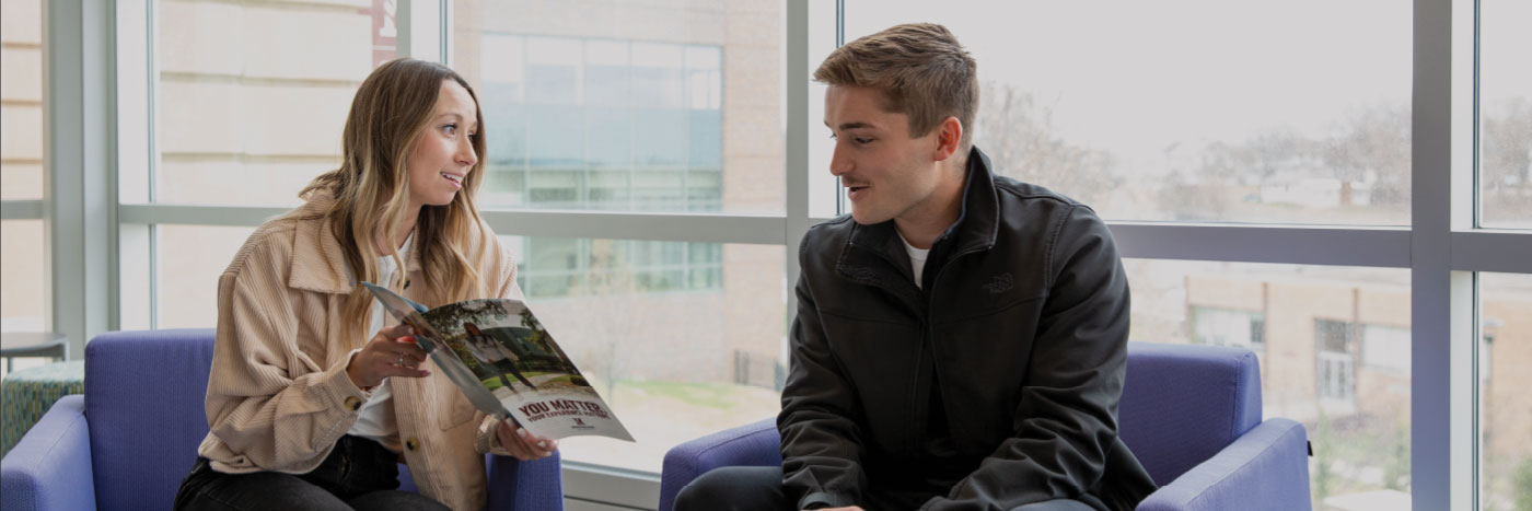 student meeting with admissions counselor