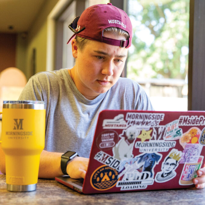 student focused on computer