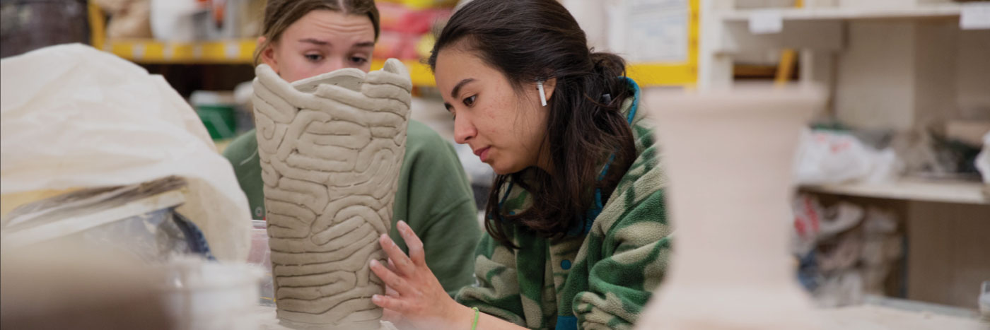students in a pottery class