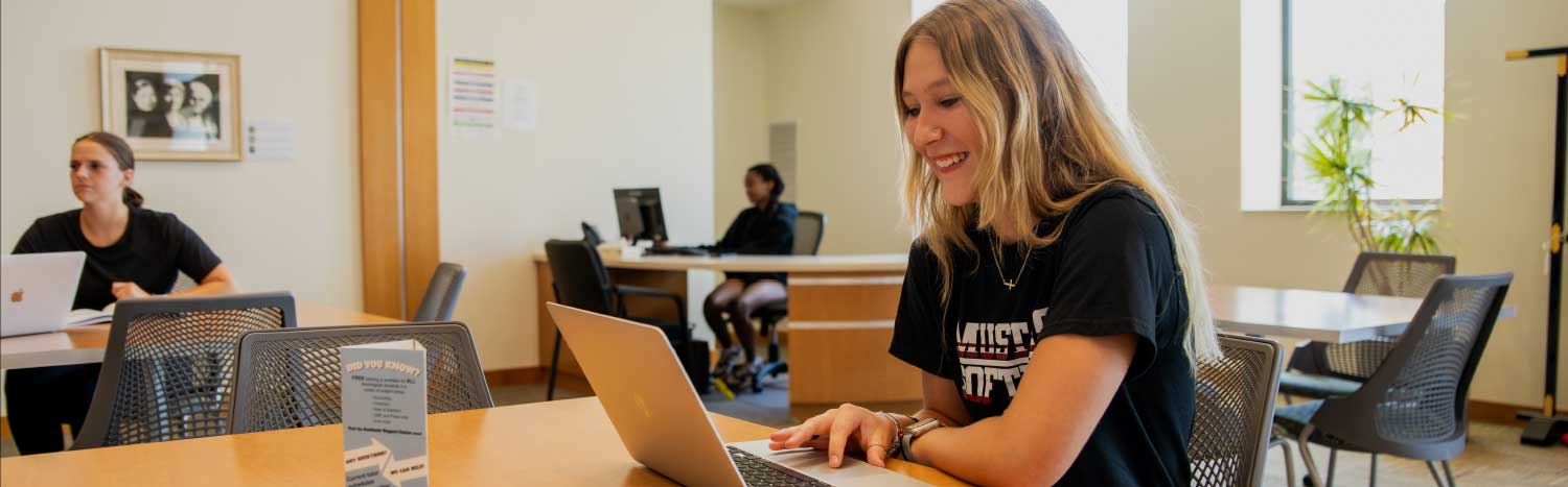 student studying in learning center